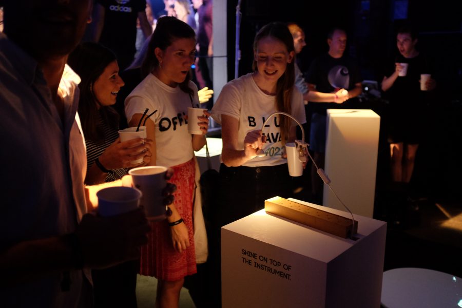 Participants create music together with Lightefface, a Cave of Sounds instrument played by shining lights onto a bed of sensors. Prototype exhibition at Village Underground, London, 2016. Photo: Tim Murray-Browne